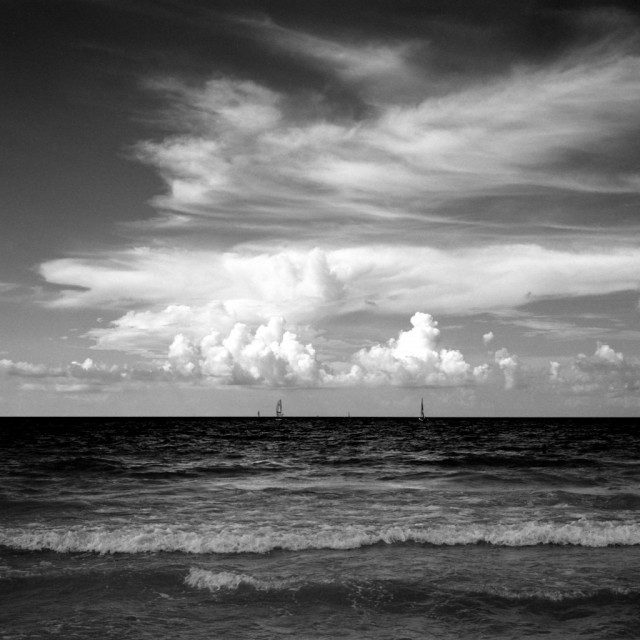 Photo: The atlantic ocean. You can see what Varadero is such a draw - warm sea, white sand and weather good for waterspouts such as sailing, diving, and wind surfing. 
As with many of my black and white photos, this was shot with a B+W orange filter, hence the almost-black sea and the dark sky.
Varadero is about 2.5 hours by taxi from Havana airport.