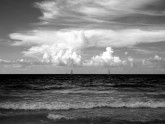 Photo: The atlantic ocean. You can see what Varadero is such a draw - warm sea, white sand and weather good for waterspouts such as sailing, diving, and wind surfing. 
As with many of my black and white photos, this was shot with a B+W orange filter, hence the almost-black sea and the dark sky.
Varadero is about 2.5 hours by taxi from Havana airport.